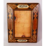 A 19TH CENTURY HISPANO MORESQUE MOORISH INLAID WOODEN FRAME, with two panels of calligraphy on bone,