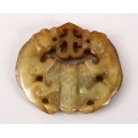 AN UNUSUAL 19TH / 20TH CENTURY CHINESE CARVED JADE PENDANT - COAT OF ARMS STYLE, carved in the
