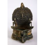 A GOOD 16TH / 17TH CENTURY INDIAN BRONZE JAIN SHRINE, 14cm high x 9cm wide.