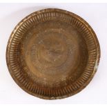 A 19TH CENTURY INDAIN BRASS CHARGER / DISH, with embossed decoration,