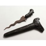 A GOOD 19TH CENTURY INDONESIAN KRIS DAGGER, with a carved wood scabbard, and a carved wood hilt,