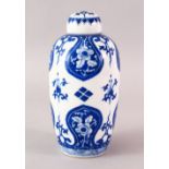 A FINE CHINESE KANGXI STYLE BLUE & WHITE PORCELAIN TEA CADDY & COVER, with panels of flora, the base