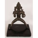 AN UNUSUAL 18TH/19TH CENTURY INDIAN BRONZE FIGURE OF VISHNU, together with a fixed slate stand,