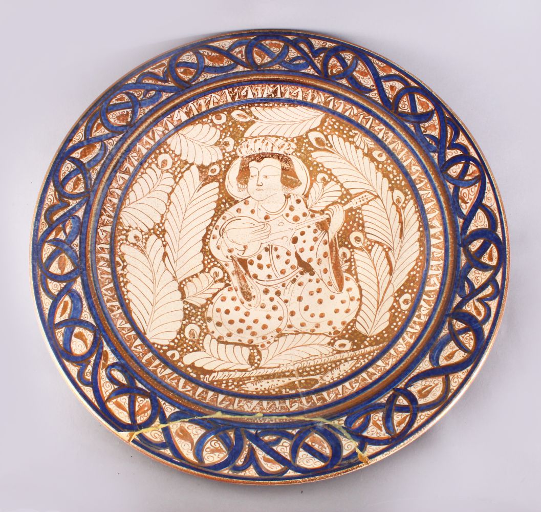 A GOOD 19TH CENTURY ISLAMIC PERSIAN POTTERY PLATE, the central decorated with an immortal /