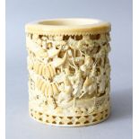 A FINE QUALITY 19TH CENTURY CHINESE CARVED IVORY VASE, the cylindrical vase carved in deep relief to