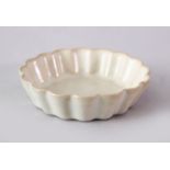 A GOOD CHINESE SONG STYLE DINGYAO MOULDED PETAL SAUCER DISH, with deep tapering sides rising from