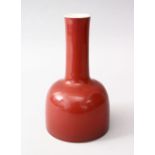 A GOOD CHINESE COPPER RED PORCELAIN BELL SHAPED VASE, the base of the vase bearing a six character