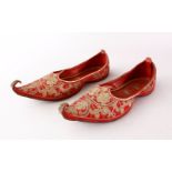 A PAIR OF 19TH CENTURY OTTOMAN SILVER THREAD EMBROIDERED LEATHER SHOES, the leather bound shoes with