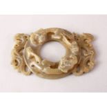 A CHINESE CARVED GREEN JADE CHILONG DISK / PENDANT, carved with chilong in archaic style, 9cm.