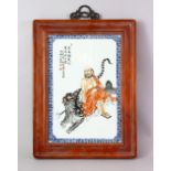 A GOOD CHINESE REPUBLIC STYLE FAMILLE ROSE PORCELAIN FRAMED PANEL OF ROHAN AND TIGER, the panel