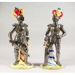 A LARGE PAIR OF ITALIAN PORCELAIN FIGURES OF MEN IN SUITS OF ARMOUR, with coloured plumes,