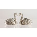 A PAIR OF CAST SILVER PLATED NOVELTY SWAN SALT AND PEPPERS.