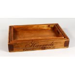 A GRADUATED SET OF THREE HARDWOOD TRAYS. Largest: 22ins long.