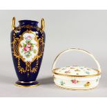 A MINTON TWO-HANDLED VASE, painted with flowers on a raised gilt and cobalt blue ground and a Minton