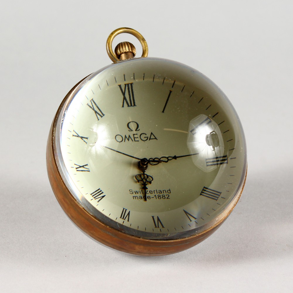 A LARGE OMEGA STYLE GLASS BALL WATCH, with open face and movement. 3ins diameter.