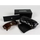 A PAIR OF CHANEL SUNGLASSES, No. 5297 C.1484/65 57019 140 3N, in a black quilted case and Chanel