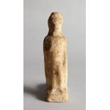 A HELLENISTIC TERRACOTTA FIGURAL VOTIVE. 4.5ins high.