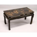 A CHINESE BLACK LACQUER LOW TABLE, with Chinoiserie decoration. 2ft 4ins long x 1ft 5ins wide x