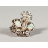 A SILVER, OPAL AND CZ RING.