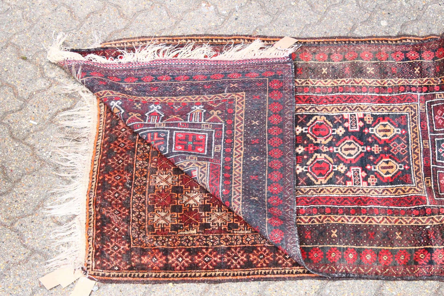 A SMALL 20TH CENTURY PERSIAN PRAYER RUG, black ground with stylised motifs. 5ft 0ins x 2ft 9ins. - Image 2 of 2