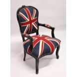 A SMALL EBONISED FRAMED FRENCH STYLE ARMCHAIR, upholstered in a Union Jack material.