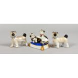 THREE SMALL CONTINENTAL PORCELAIN FIGURES OF DOGS. 2ins long.