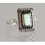 A SILVER AND OPAL DECO DESIGN RING.