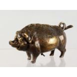 A NOVELTY BRONZE PIG BELL. 6.5ins long.