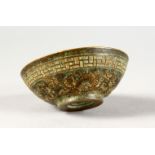 A TINY CHINESE BRONZE CIRCULAR BOWL. 2.25ins diameter.