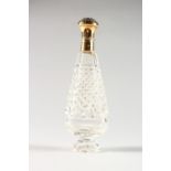 A HOBNAIL CUT 18CT GOLD TOP SCENT BOTTLE. 4ins long.