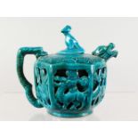 A CHINESE TURQUOISE GLAZED TEAPOT, with reticulated sides. 5ins high.