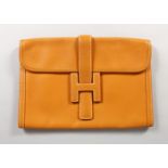 A PLAIN LEATHER HERMES CLOTH BAG, 7.5ins x 11ins, in a Hermes Bag.