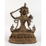 A CHINESE CAST BRONZE FIGURE OF A SEATED FEMALE DEITY, holding a sword in her right hand. 12ins