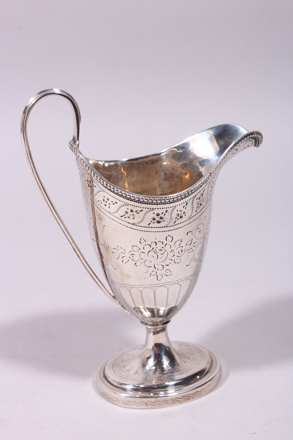 A GOOD GEORGE III ENGRAVED HELMET SHAPED MILK JUG, with reeded handle and base. London 1782. - Image 6 of 9