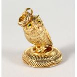 A GOLD PLATED OWL SEAL.