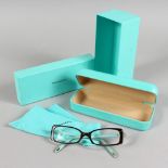 A PAIR OF TIFFANY & CO GLASSES, TF 2035 8134 50016 135, in a grey Tiffany & Co carry case and box.