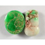 TWO CARVED CHINESE JADE PENDANTS.
