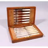 A SET OF SIX GEORGE III DESSERT KNIVES AND FORKS, with mother-of-pearl handles, Sheffield 1812, in