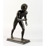 AFTER THE ANTIQUE, a good small cast bronze figure of a young naked athlete. 8.5ins high.