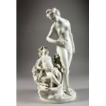 A 19TH CENTURY SEVRES WHITE BISCUIT GROUP OF 'LA LECON A L'AMOUR', the figure of Venus seated on a