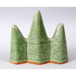 A GOOD CHINESE CELADON LONGQUAN GROUND MOULDED BRUSH STAND / REST, with moulded decoration of