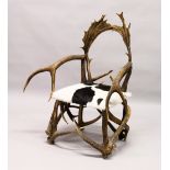 A GOOD GROTTO OR HUNTING LODGE ARMCHAIR, 20TH CENTURY, the frame constructed from deer antlers,