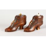 TWO GOOD CARVED BOOT SHAPED SNUFF BOXES, each inset with miniature dice beneath the soles. 4.5ins