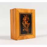 A TUNBRIDGE WARE BOX, the lift-off top with marquetry flower. 4ins long.