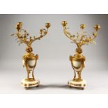 A GOOD PAIR OF ORMOLU AND MARBLE URN SHAPED CANDELABRA, each with three naturalistic scrolling