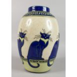 AN ART DECO DESIGN VASE, decorated with blue cats. 12ins high.