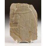 A SMALL LIMESTONE PANEL, carved with a female Egyptian bust. 9ins x 6.5ins.