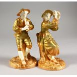 A PAIR OF ROYAL WORCESTER PORCELAIN FIGURES, modelled as the boy piper Stephon and companion