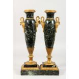 A PAIR OF MARBLE AND ORMOLU URNS, MID 20TH CENTURY, with handles formed as swans, on square bases.