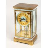 A CLOISONNE DECORATED BRASS FOUR GLASS CLOCK, eight-day movement, striking on a gong. 9.25ins high.